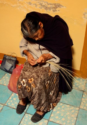 A vieja labors over her craftwork in San Cristóbal Zapotitlán