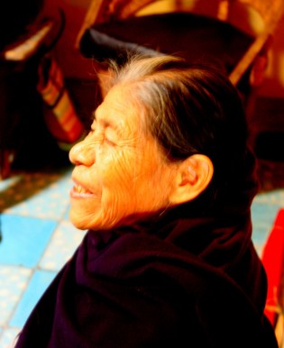 The artisan looks up from her work in satisfaction.