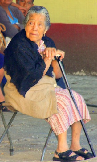 A vieja waits patiently for a ceremony to begin in Ajijic