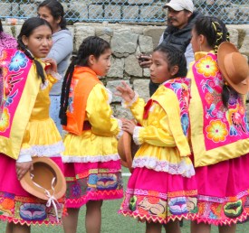 Girls in traditional garb in advance of the Mother's Day celebration.