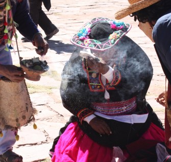 Smoldering incense fills the air