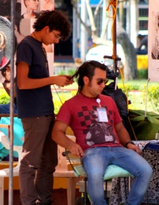 Getting a haircut in Guadalajara's Parque Revolución.