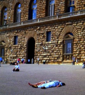 Tourists take a break to sun themselves, Florence, Italy