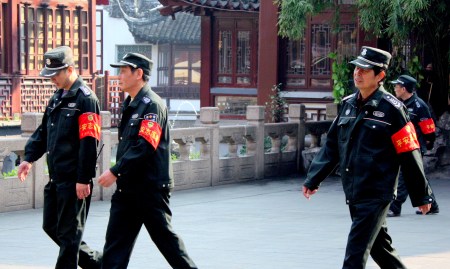 Police offers stroll through Old Shanghai.