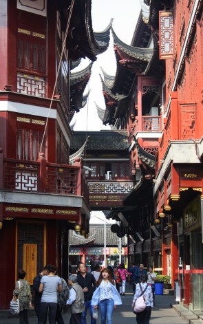 Rooftops almost touch above narrow lanes.