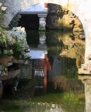 Reflections in a pond are part of the composition.